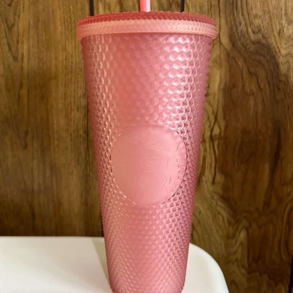 Pink studded Starbucks tumbler